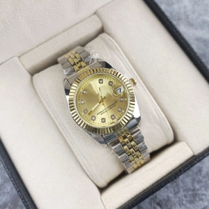 Classic silver and gold quartz watch with diamond markers in a beige luxury gift box