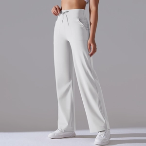 Detail of high waisted wide leg yoga pants with drawstring waist and side pockets