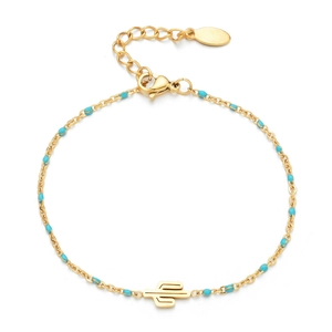 Detail of bohemian gold chain bracelet featuring blue beads and cactus charm pendant
