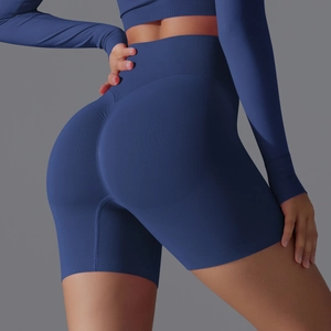 Close-up of seamless dark blue high-waist yoga shorts showing honeycomb texture and butt lifting