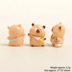 Detailed front, side, and back views of a cute resin Capybara miniature figurine with yellow bag