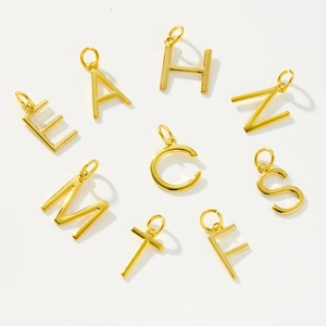 Polished S925 sterling silver gold A-Z initial pendant necklaces on white background