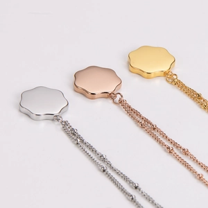 Minimalist flower pendant necklaces in gold, silver, and rose gold polished finishes