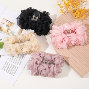 Elegant large chiffon bow hair claws in black, white, and pink for women's hairstyling