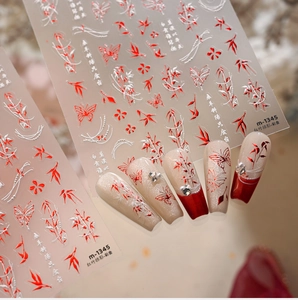 Detailed view of bamboo and butterfly nail art stickers on long coffin false nails