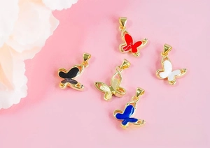 Close-up of colorful butterfly charms with gold plating and drop oil craftsmanship