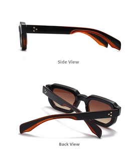Detail view of retro square black and orange sunglasses with golden metal rivets