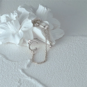 Macro detail of S925 sterling silver chain earrings with marquise cut opal stones