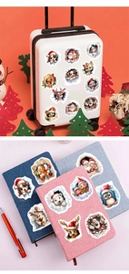 Christmas 3D stickers on suitcase and notebooks with Santa, reindeer and snowman themes