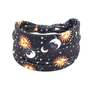 Detail of wide elastic headband featuring celestial moon and sun print patterns
