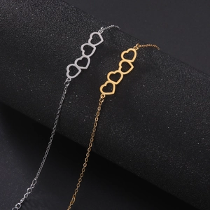Fashionable stainless steel bracelets with four connected hollow hearts in gold and silver