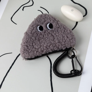 Macro shot of grey plush triangle coin purse with large eye embroidery and spring clip