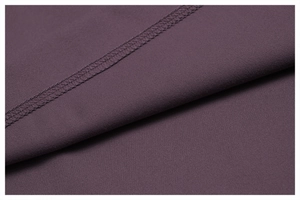 Macro detail of high-quality mauve yoga set fabric with durable double-needle stitching