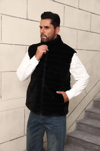 Detail of men's faux fur vest showing black texture, stand collar, and zipper closure