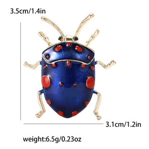Blue enamel beetle brooch with red spots and size measurements on white background