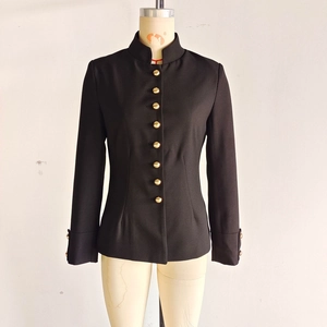 Detail of black slim-fit jacket with stand collar and decorative gold metal buttons