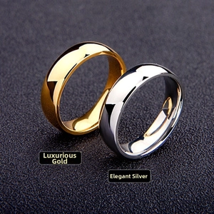 Close-up of polished gold and silver titanium rings with a smooth metallic mirror finish