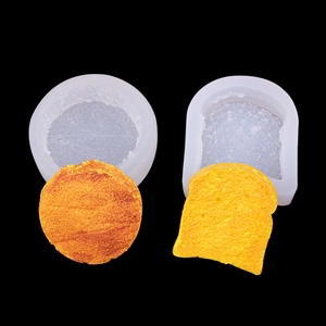Macro detail of silicone molds and realistic toast-shaped soap crafts in toasted brown