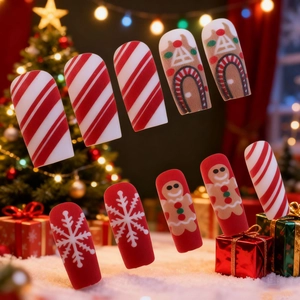 Weihnachts-Kunstnägel Set mit Lebkuchenmann, Schneeflocken und roten Streifenmustern