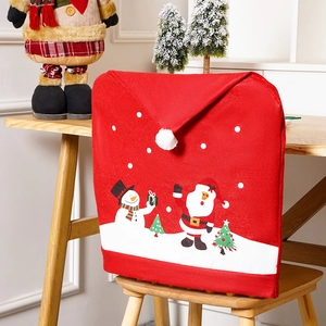 Detail of Christmas chair cover with Santa and Snowman prints in a festive scene