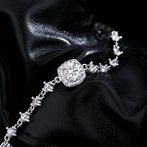 Luxurious S925 sterling silver bracelet featuring a square moissanite center stone on leather