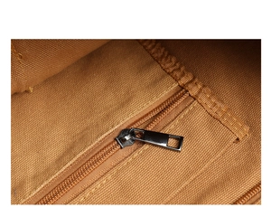 Detailed close-up of the interior zip pocket and canvas texture of the brown messenger bag