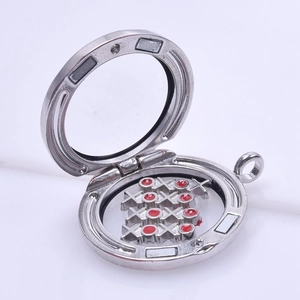 Silver floating living locket with magnetic closure and decorative charms inside