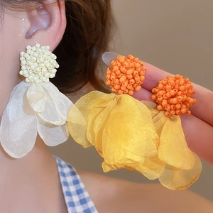 Detail of elegant chiffon flower tassel earrings with lightweight organza petals