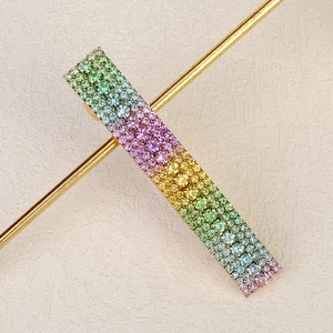 Rainbow crystal hair clip with multi-colored rhinestones on gold-tone metal base