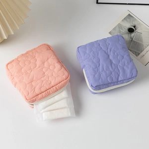 Quilted floral sanitary pad pouch in pink and purple colors with zipper closure