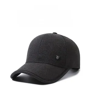 Detail shot of breathable grey baseball cap fabric with a small shield logo on the side