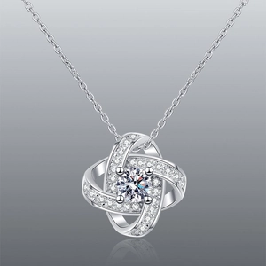 Elegant silver four-prong diamond pendant necklace with micro-pave zircon halo on gray base