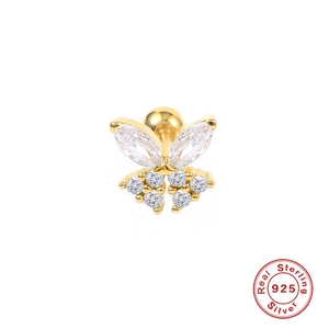 Macro detail of golden S925 sterling silver butterfly stud earring with crystal wings