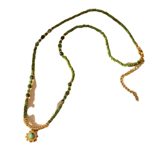Green stone beaded necklace with sun pendant and adjustable gold-plated chain