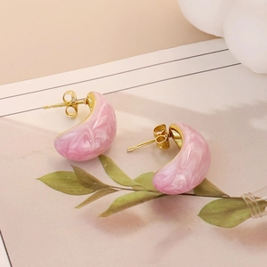Pink marble enamel teardrop earrings with gold plating in a lifestyle aesthetic setting