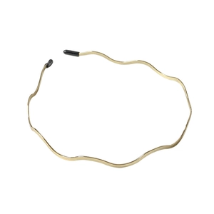Minimalist gold wavy metal headband with black rubber tips for women on white background