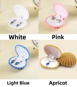 Shell-shaped velvet jewelry box in four colors: white, pink, light blue, and apricot
