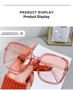 Detail of square oversized sunglasses with transparent pink frame and gradient lenses