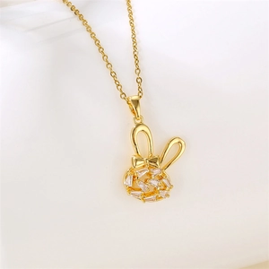 Golden rabbit necklace with cubic zirconia pendant on a clean white background