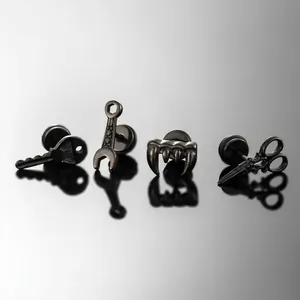Gothic punk stainless steel stud earrings featuring key, wrench, fangs, and scissors shapes