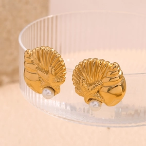 Detailed macro shot of 18K gold plated seashell and starfish earrings with white pearls