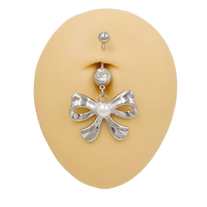Silver stainless steel belly button ring with crystal bow and pearl on model