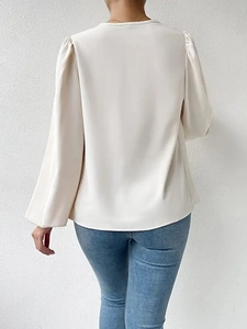 Back view of elegant off-white chiffon long sleeve blouse with silky draped texture