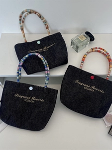 Three-piece denim tote bag set with golden embroidery and colorful beaded handles