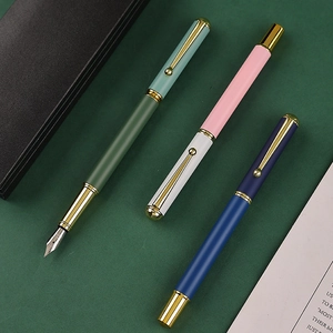 Morandi metal business fountain pen set with gold clips on a dark green background