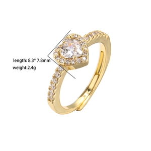 Detail shot of brass heart ring with micro-pave cubic zirconia and adjustable band