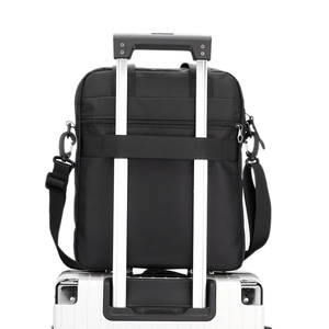 Business shoulder bag for men with back strap secured to silver luggage handle