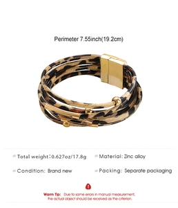 Macro shot of multi-layer leopard print leather bracelet with magnetic gold alloy clasp