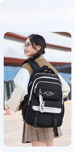 Close-up of lightweight large capacity black student backpack with contrast zippers