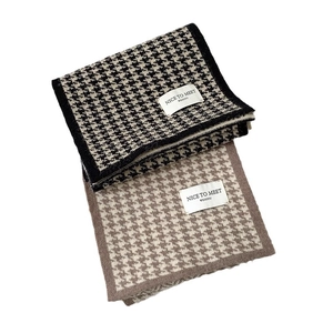 Classic houndstooth knitted scarves in black-white and brown-white on white background
